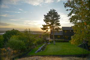 View of front facade with a lawn