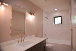 Full bath featuring vanity and bathtub / shower combination