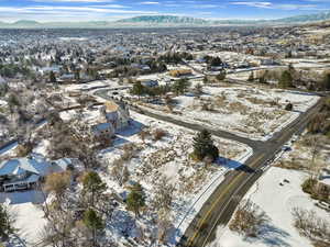 Snowy aerial view featuring a mountain view