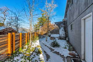 View of yard covered in snow