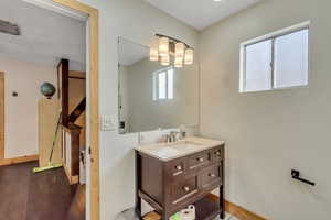 Bathroom with vanity and wood finished floors