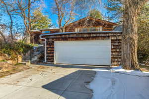 Garage featuring concrete driveway