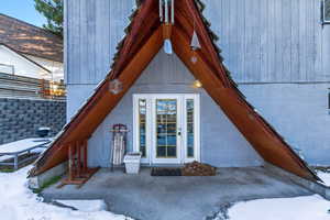 View of snow covered property entrance