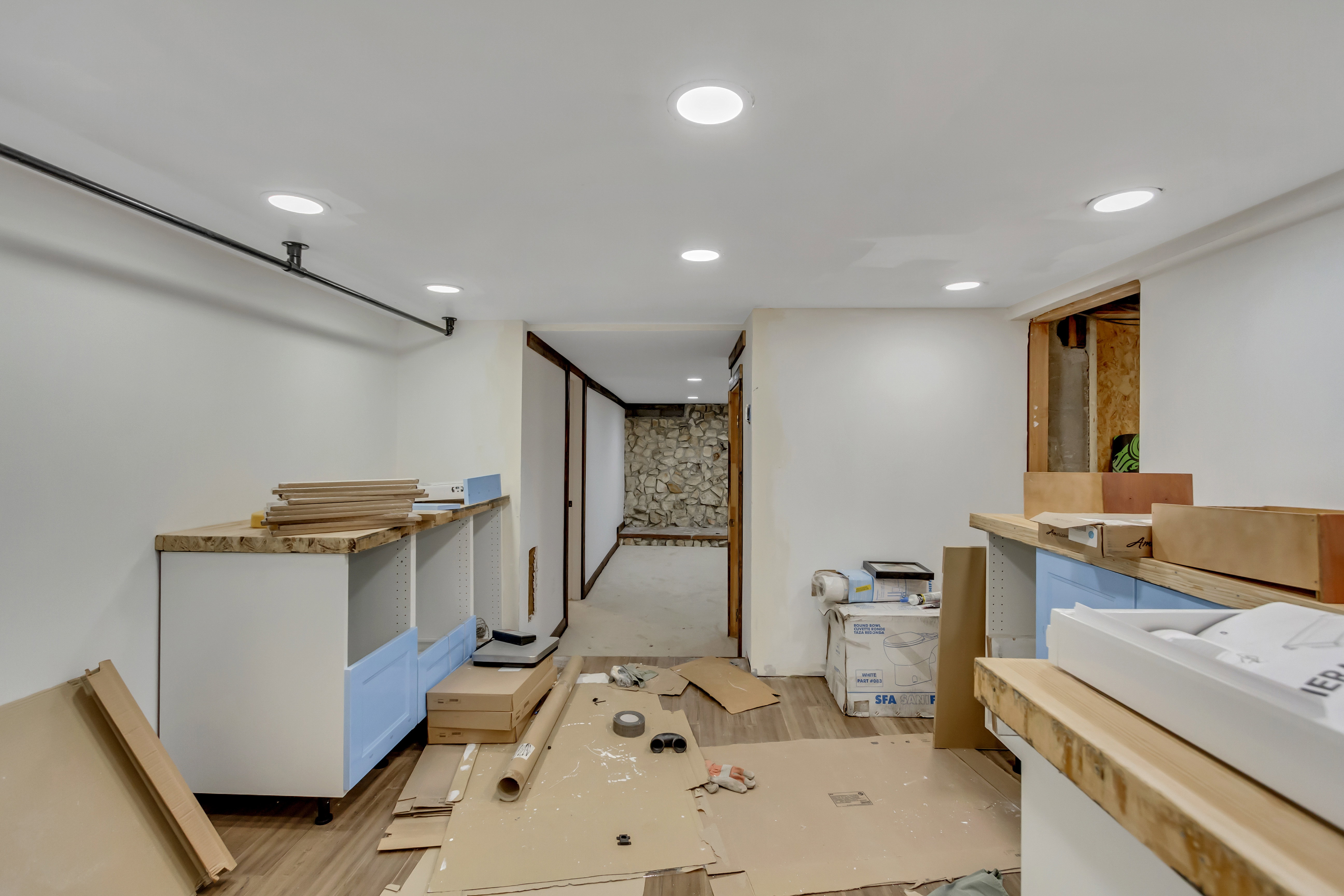 Below grade area with wood finished floors and recessed lighting