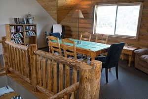 Dining space with vaulted ceiling