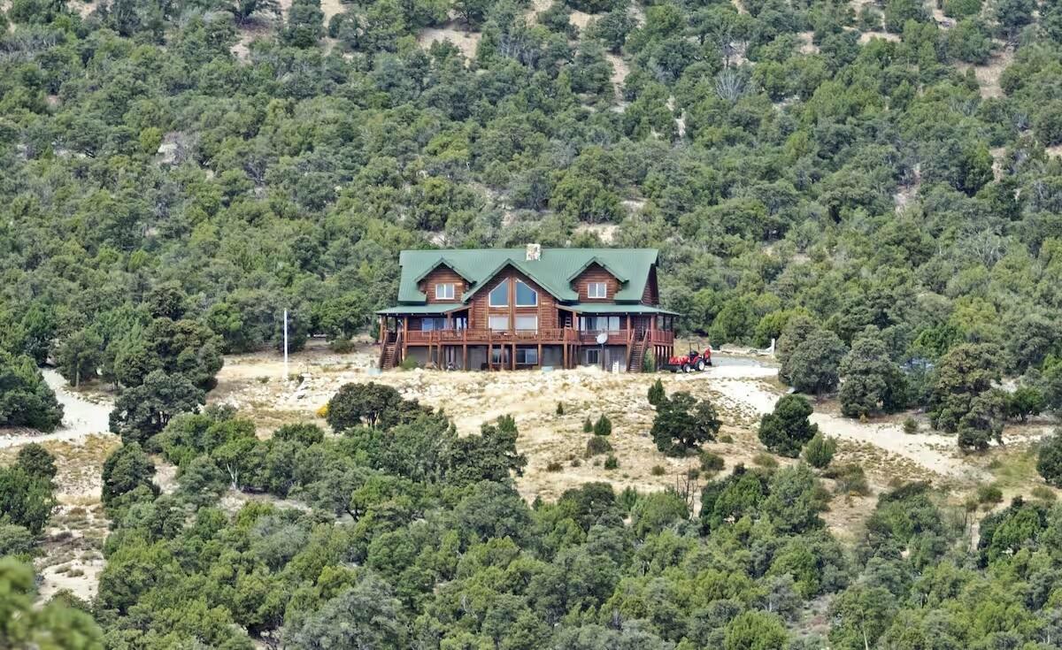 View from above of property with a heavily wooded area