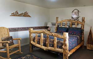 Bedroom with carpet and baseboards