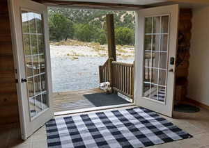 Entryway with tile patterned flooring