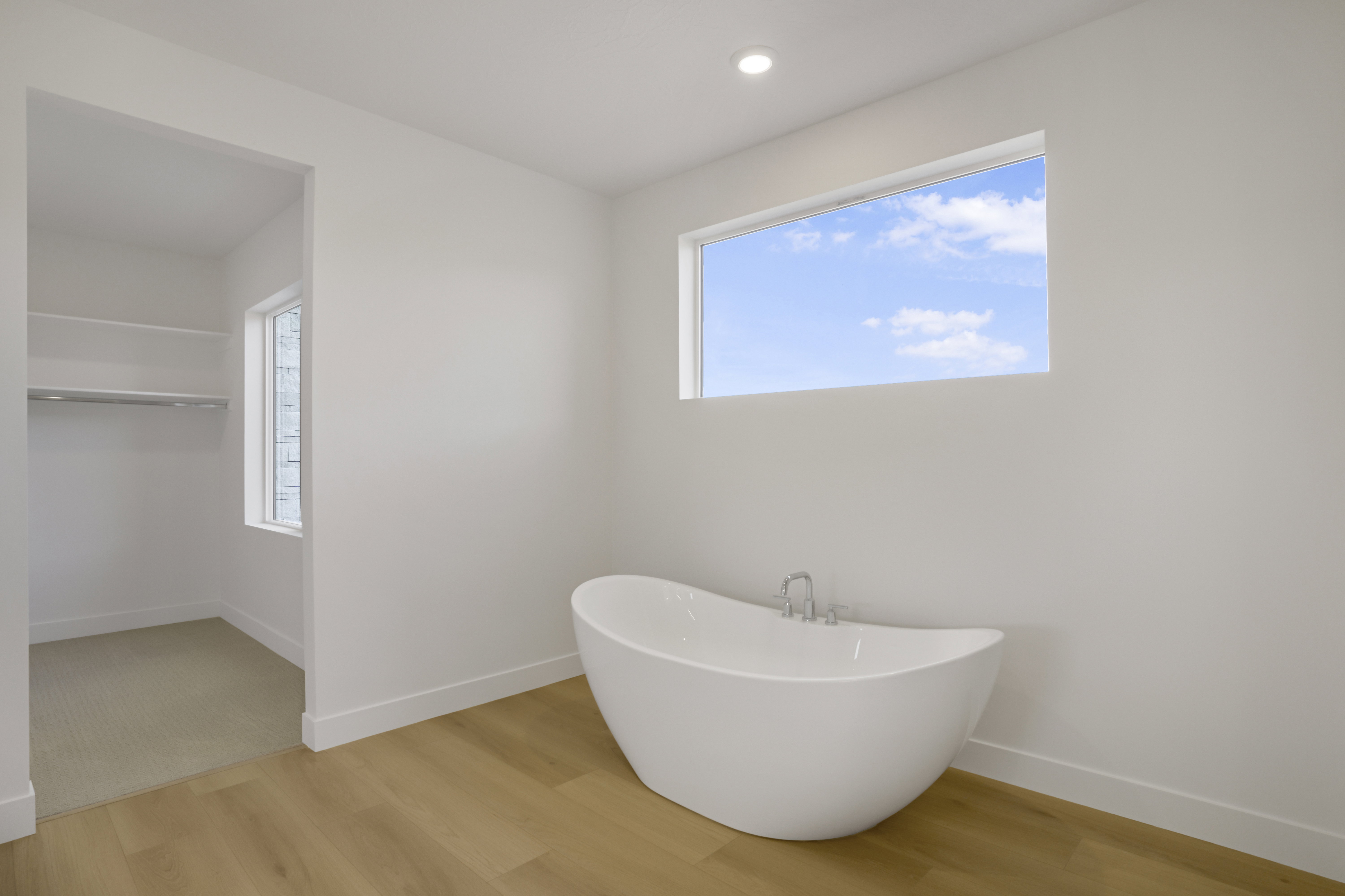 Modern freestanding bathtub with chrome fixtures