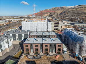Aerial view of an industrial area and a mountain backdrop
