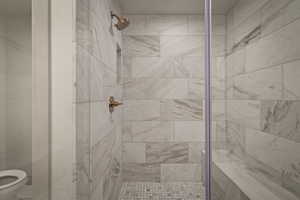 Full bath featuring a shower stall