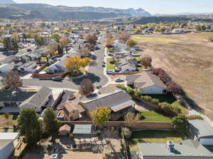 Aerial perspective of suburban area featuring a mountainous background