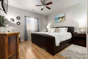 Bedroom featuring light wood-type flooring and a ceiling fan