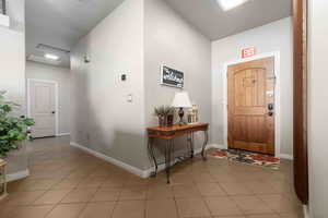 Foyer featuring light tile patterned floors