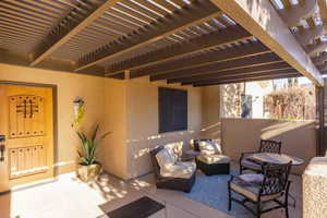View of patio with a pergola and an outdoor living space