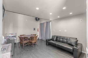 Living area with recessed lighting and wood finished floors