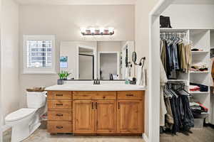 Full bathroom featuring vanity and a shower stall