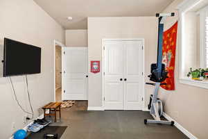 Exercise area featuring baseboards