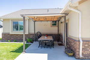 View of patio / terrace featuring a pergola and outdoor dining area