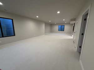 Recreation  room featuring recessed lighting and light colored carpet