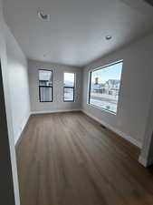 Flexroom with light wood-style floors, recessed lighting, and a textured ceiling