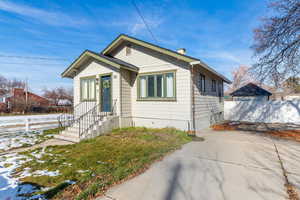 Bungalow-style home featuring a chimney