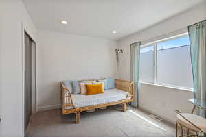 Sitting room featuring carpet flooring and recessed lighting
