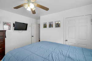Bedroom featuring a ceiling fan