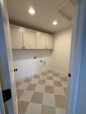 Laundry room with recessed lighting, light floors, washer hookup, dryer hookup, and cabinet space
