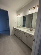 Master full bathroom featuring double vanity