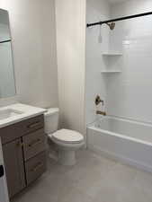 Full bathroom with vanity,  shower combination, and light tile patterned floors