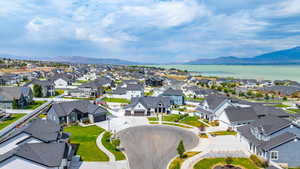 Aerial view of residential area featuring a mountainous background