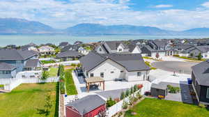 Aerial perspective of suburban area with a water and mountain view