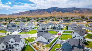 Aerial view of residential area featuring mountains