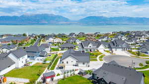 Aerial view of residential area featuring a water and mountain view