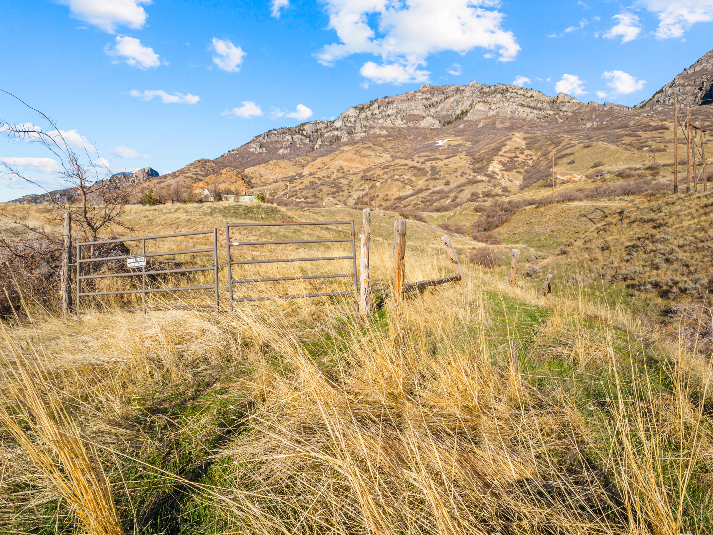 View of mountain backdrop featuring rural landscape