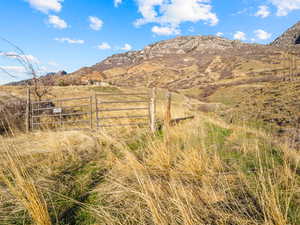 View of mountain backdrop featuring rural landscape