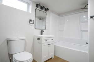 Full bath featuring shower / bathtub combination and vanity