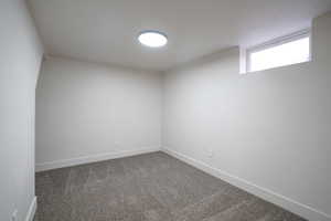 Spare room with carpet flooring and baseboards