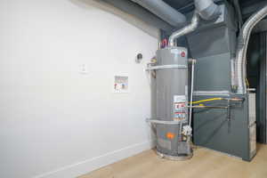 Utilities featuring strapped water heater and heating unit