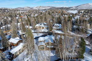 Snowy aerial view with a mountain view