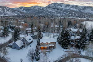 Snowy aerial view with a mountain view