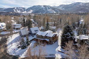Snowy aerial view with a mountain view