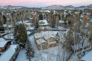 Snowy aerial view with a mountain view