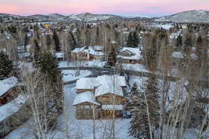 Snowy aerial view with a mountain view