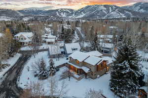 Snowy aerial view with a mountain view