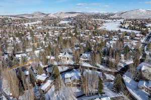 Snowy aerial view with a mountain view
