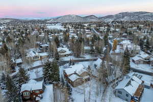 Snowy aerial view featuring a mountain view