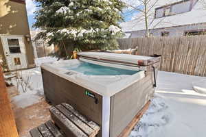View of yard with a salt water hot tub