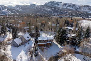 Snowy aerial view featuring a mountain view